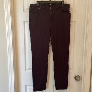 Woman’s plum colored denim pants